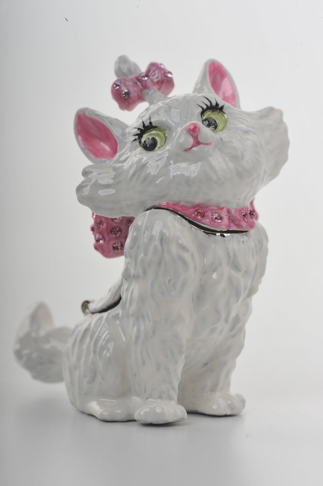 White ceramic cat figurine with pink bow and collar on a white background