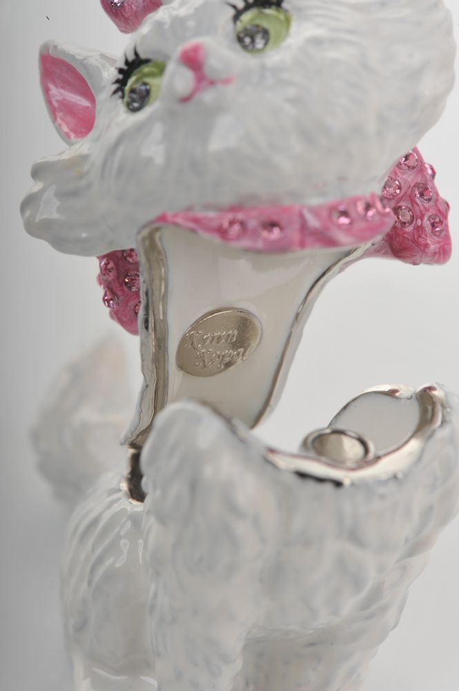 Cat-shaped shoe with decorative pink bow and 'Betsey Johnson' branding on a white background