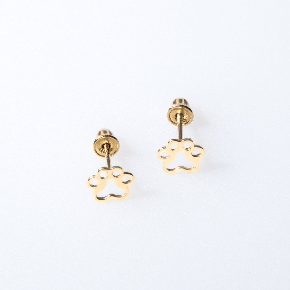 Gold paw print earrings on a white background