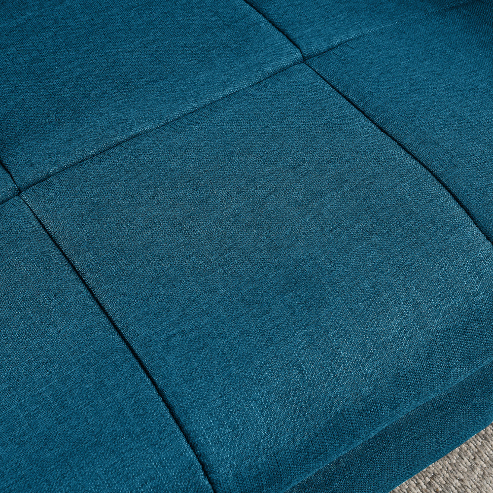Close-up of a blue fabric surface with stitching details
