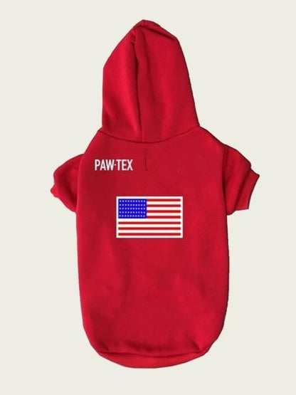 Red pet hoodie with American flag and 'PAW-TEX' branding on a beige background