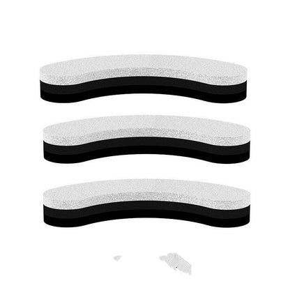 Three black and white shoe inserts on a white background