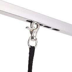 Close-up of a metal hook attached to a white surface with a black lanyard.