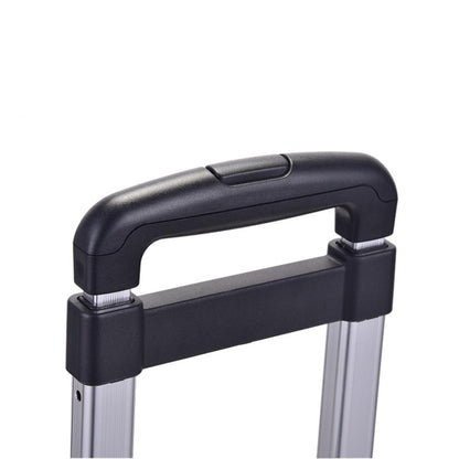 Close-up of a black suitcase handle on a white background