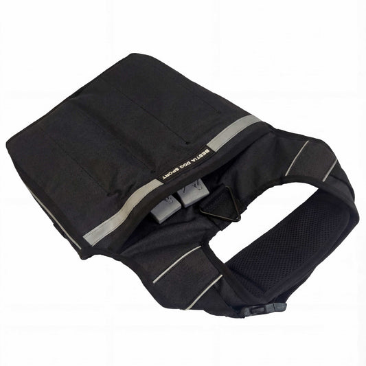 Black dog harness with reflective stripes on a white background