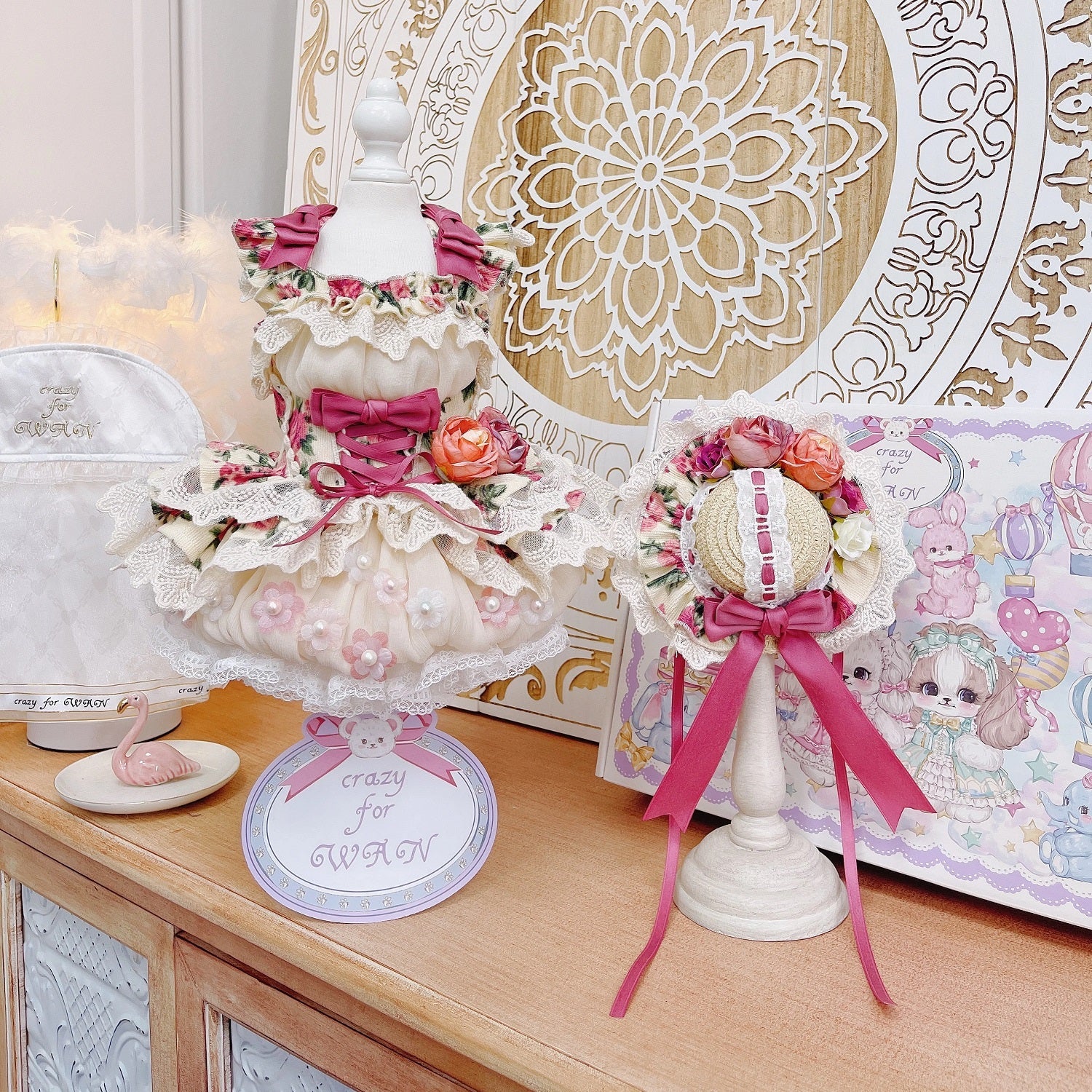 Decorative items on a wooden surface with a decorative wall in the background