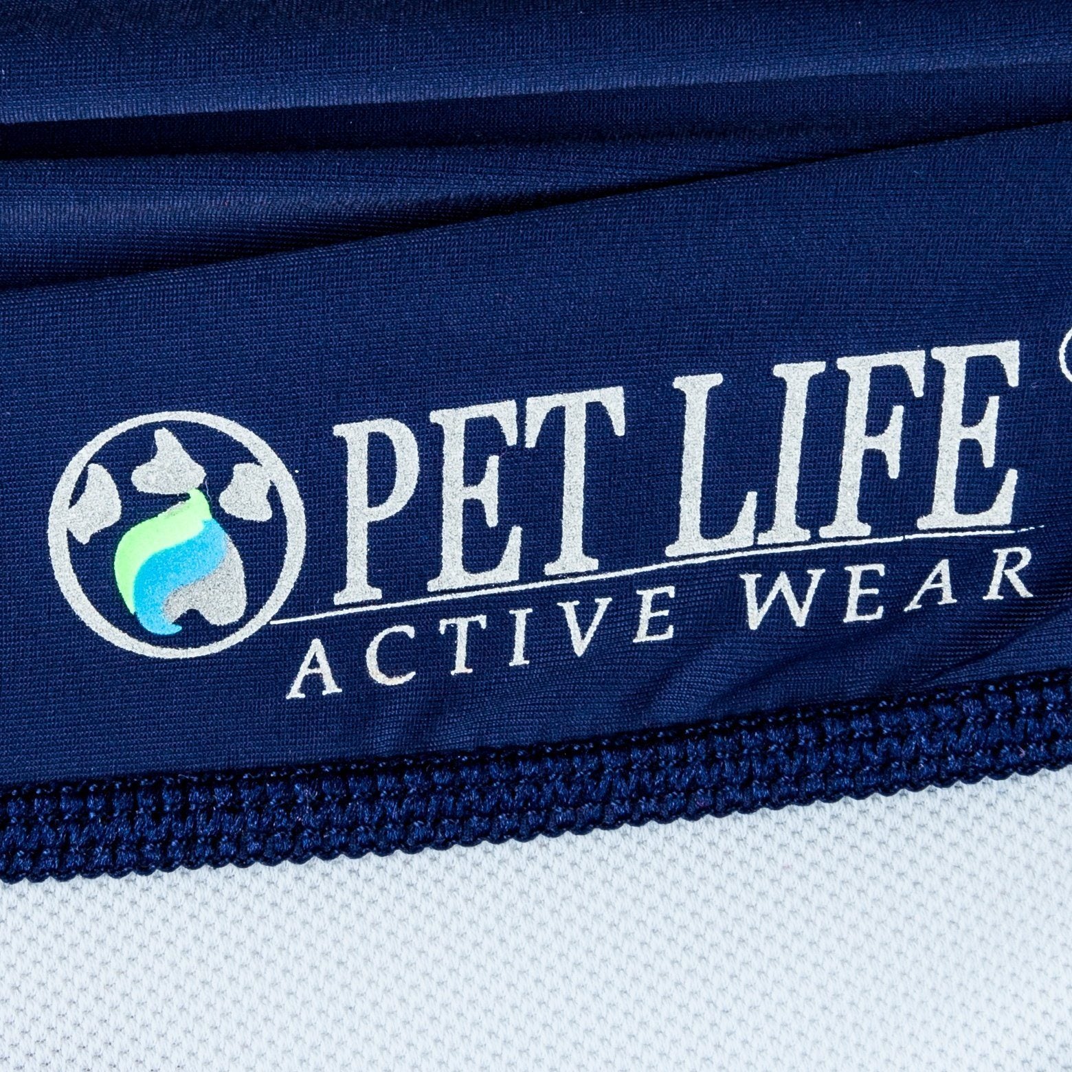 Close-up of 'Pet Life Active Wear' logo on a blue fabric background