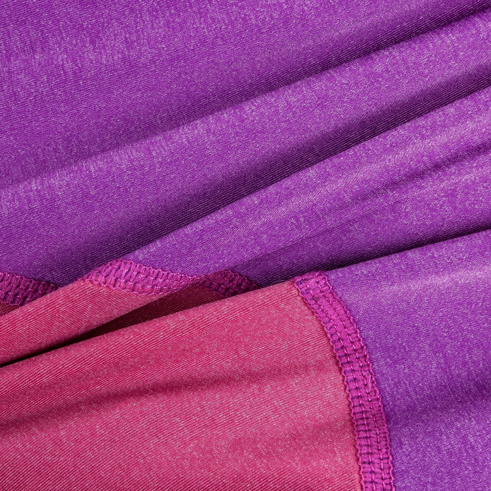 Close-up of purple and pink fabric with a textured pattern