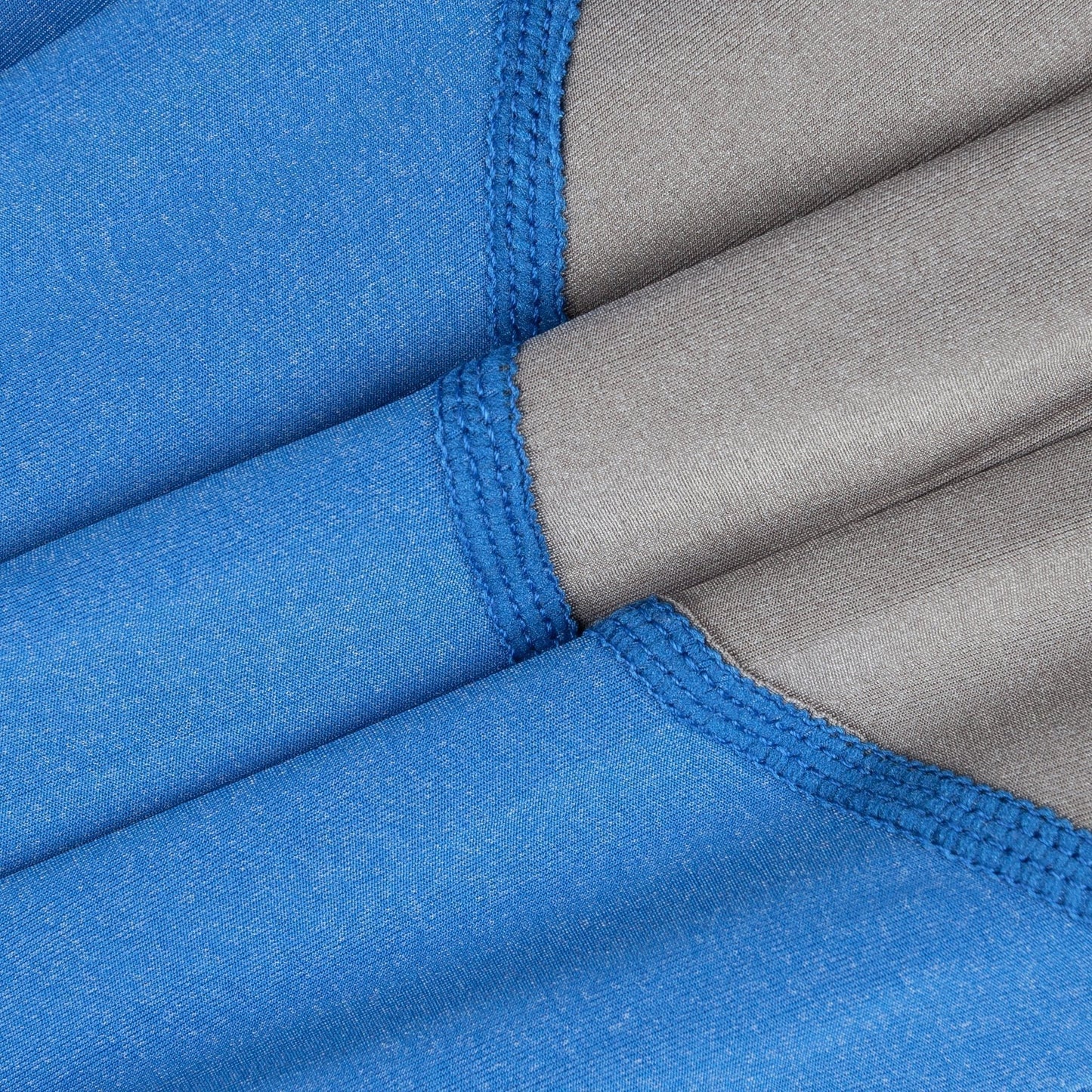 Close-up of blue and gray fabric with a visible seam