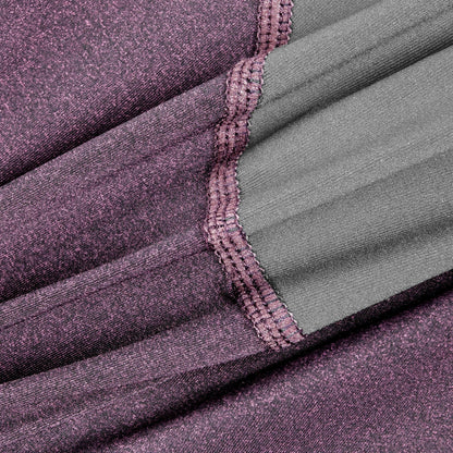 Close-up of purple fabric with a textured pattern and green lining.