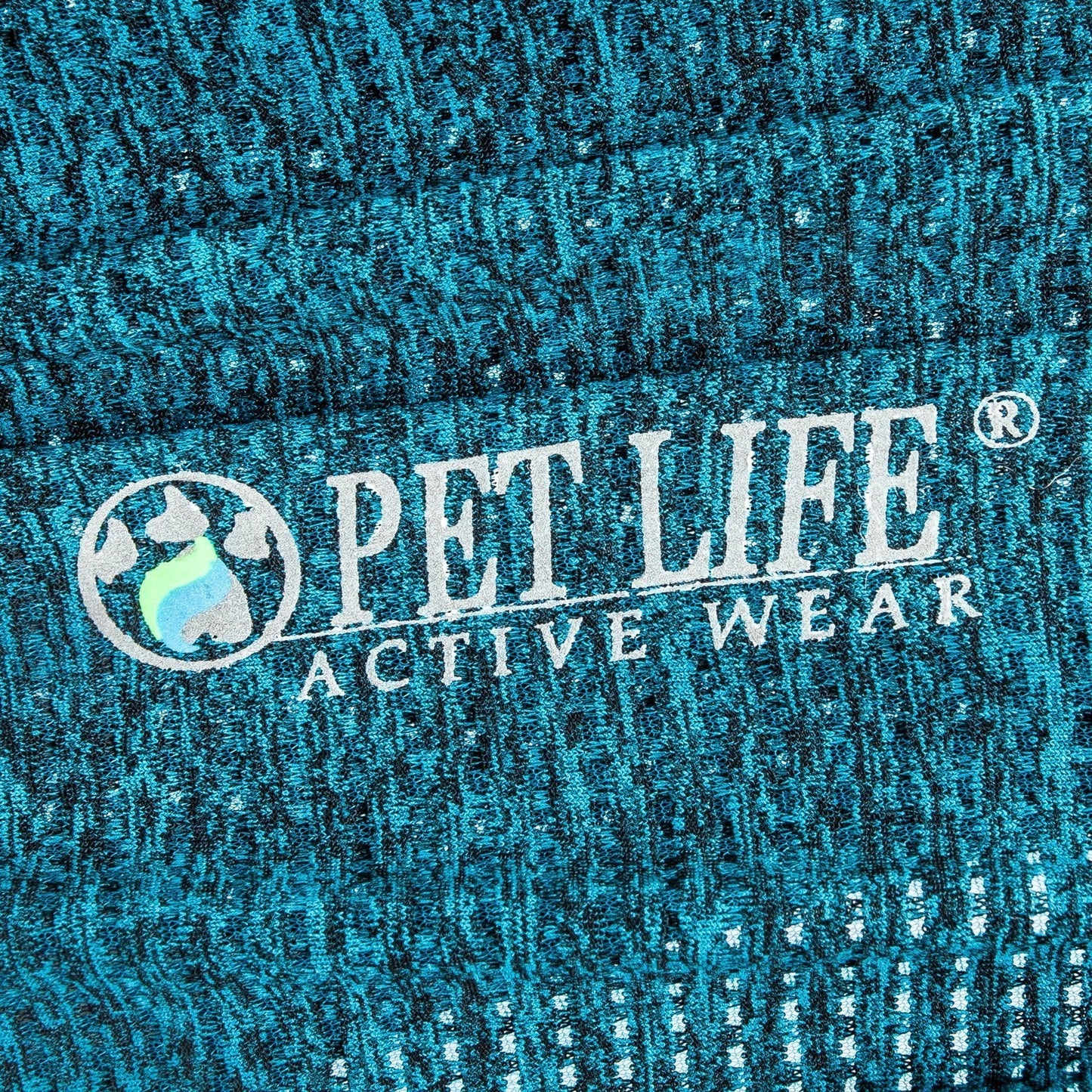 Close-up of 'Pet Life Active Wear' logo on textured blue fabric.