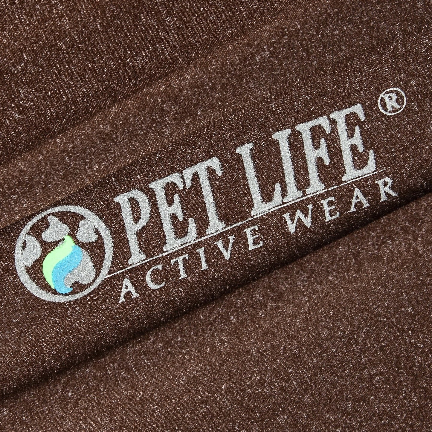 Close-up of 'Pet Life Active Wear' logo on brown fabric