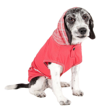 Dog wearing a red hooded coat on a white background