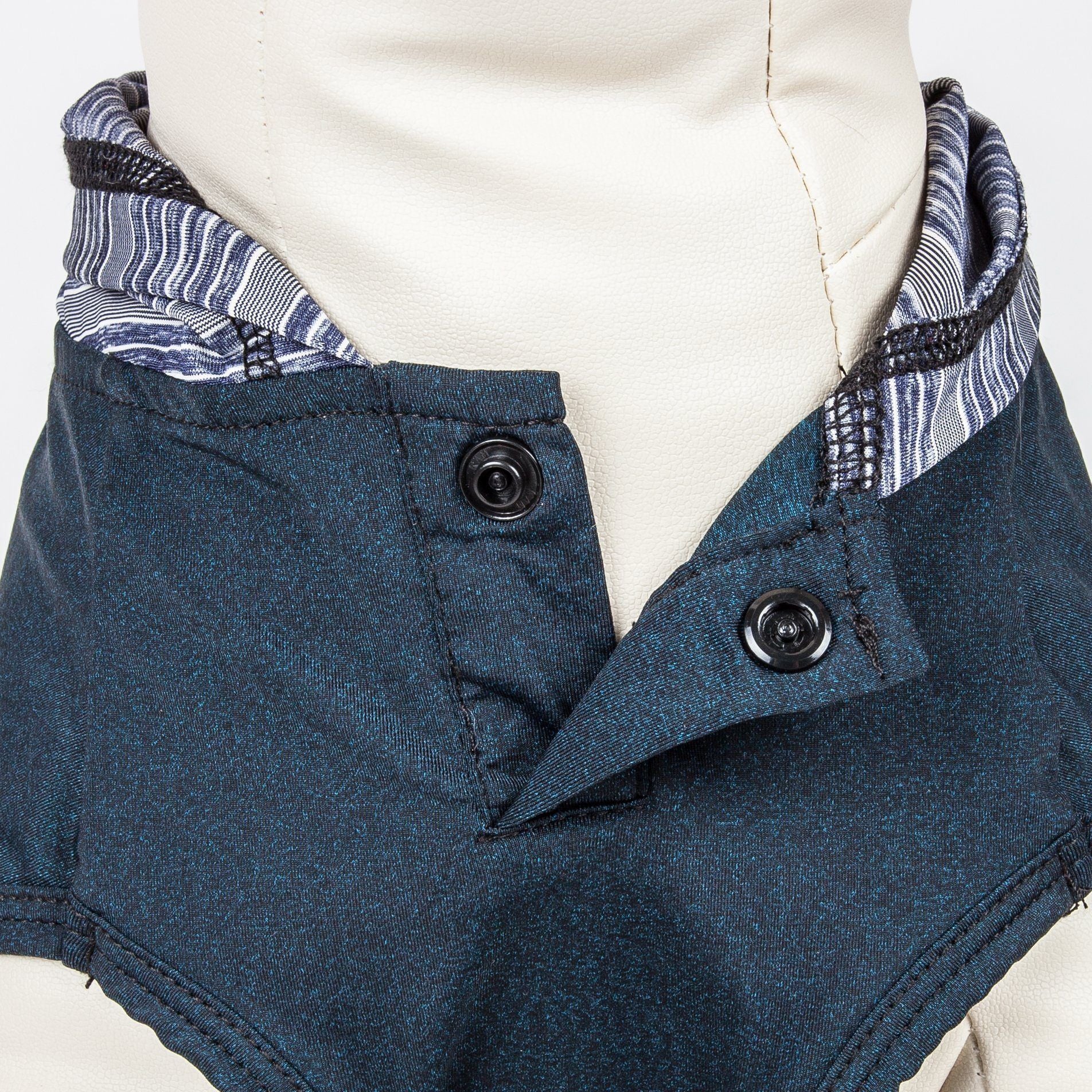 Blue jacket with patterned lining on a mannequin against a white background