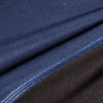 Close-up of blue and black fabric with a visible seam