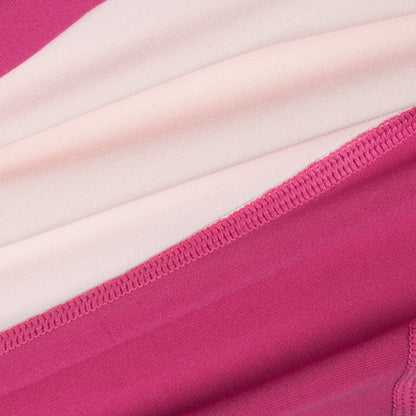 Close-up of pink and white striped fabric with a focus on texture and pattern.