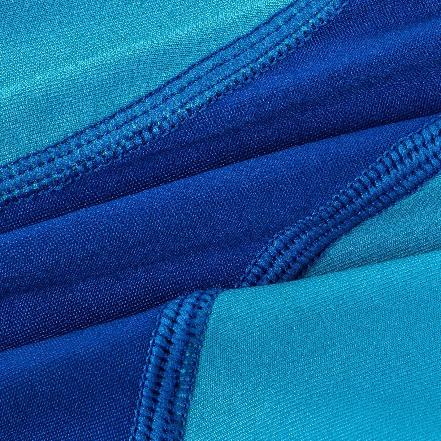 Close-up of blue fabric with zipper details