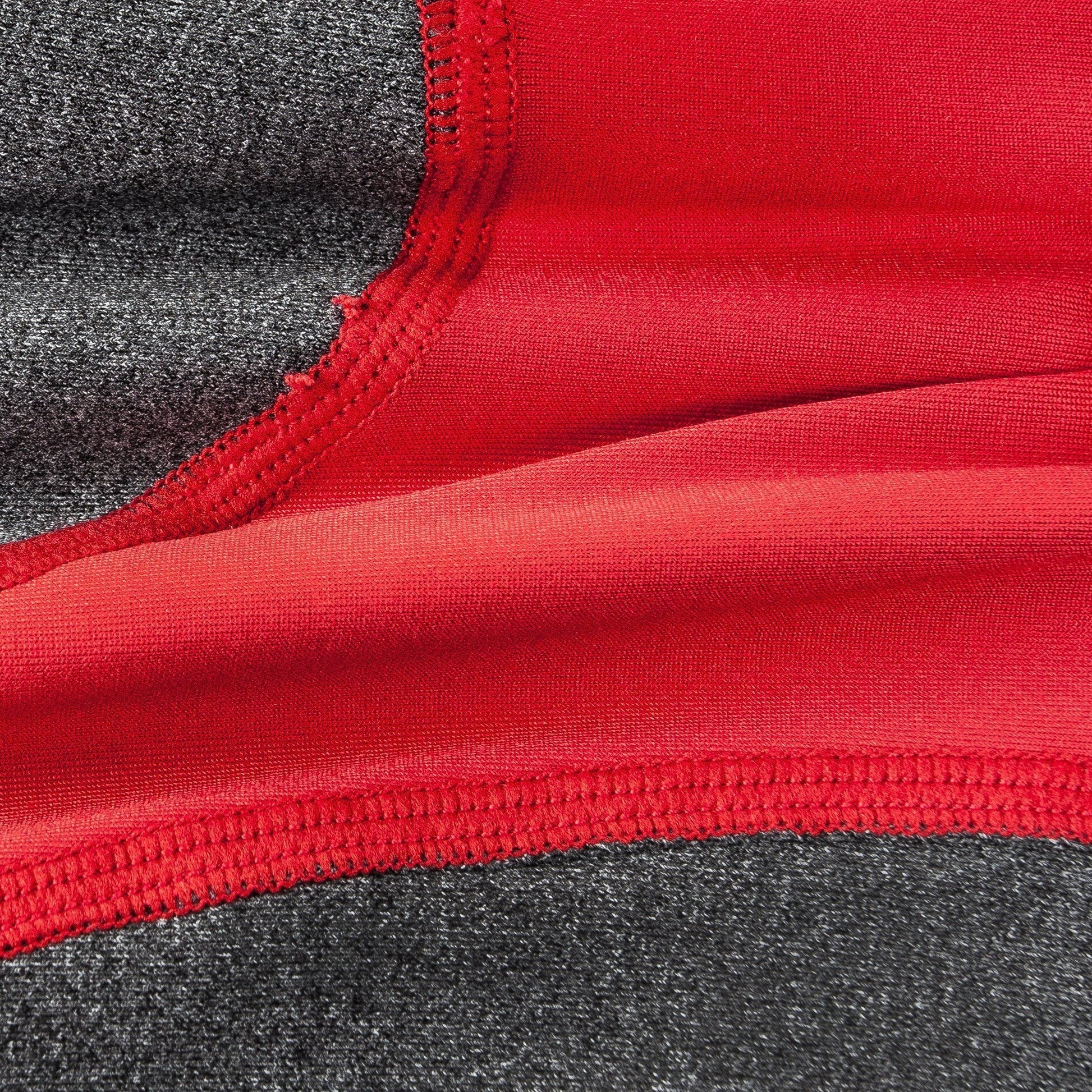 Close-up of red and gray fabric with a visible seam
