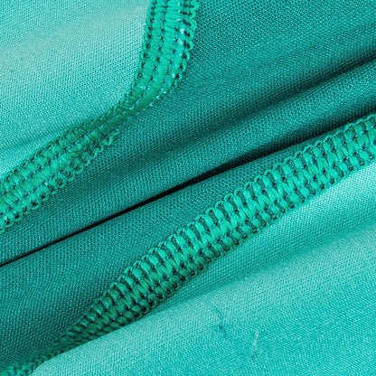 Close-up of teal fabric with a zipper