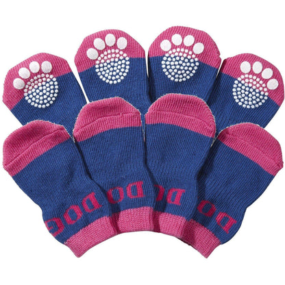 Set of blue and pink dog socks with paw pattern on a white background