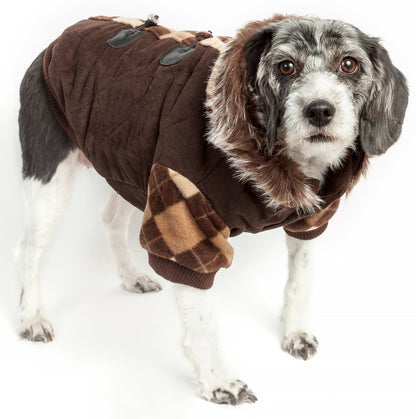 Dog wearing a brown coat with plaid accents on a white background