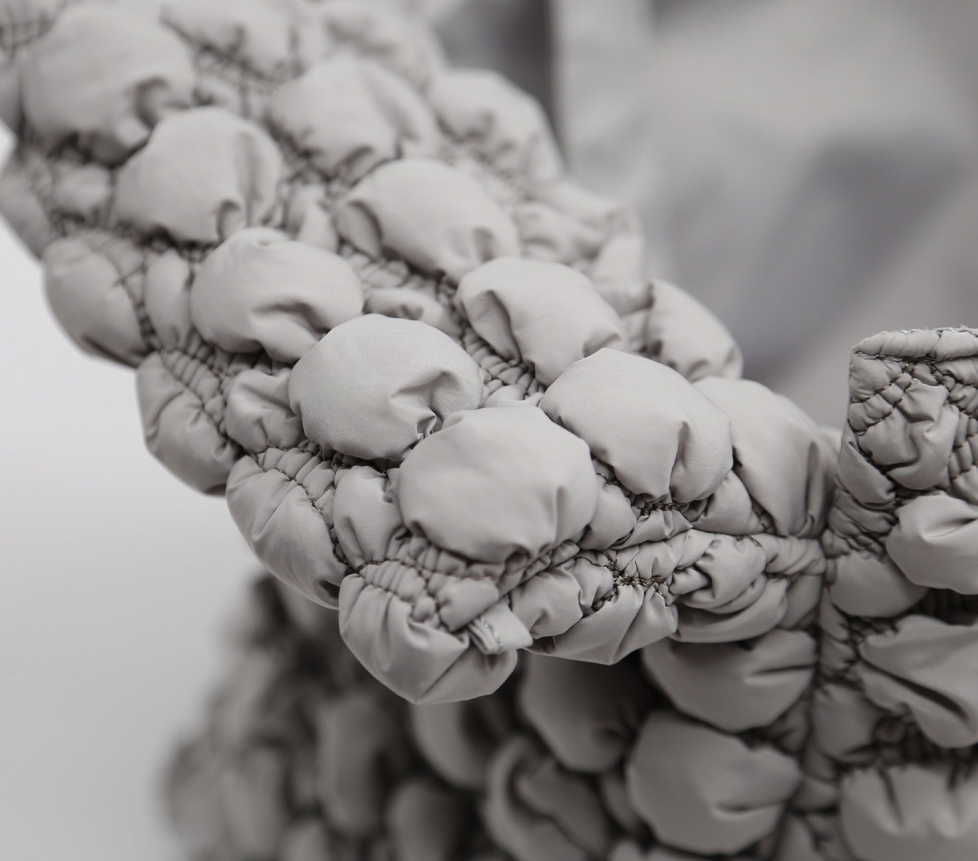 Close-up of a textured fabric surface with a blurred background