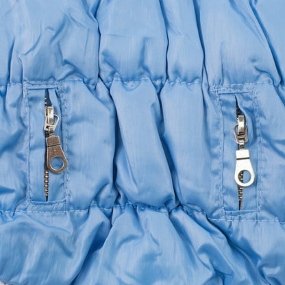 Close-up of a blue jacket with zippers on a white background