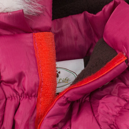 Close-up of a pink jacket with red trim and a visible brand logo.