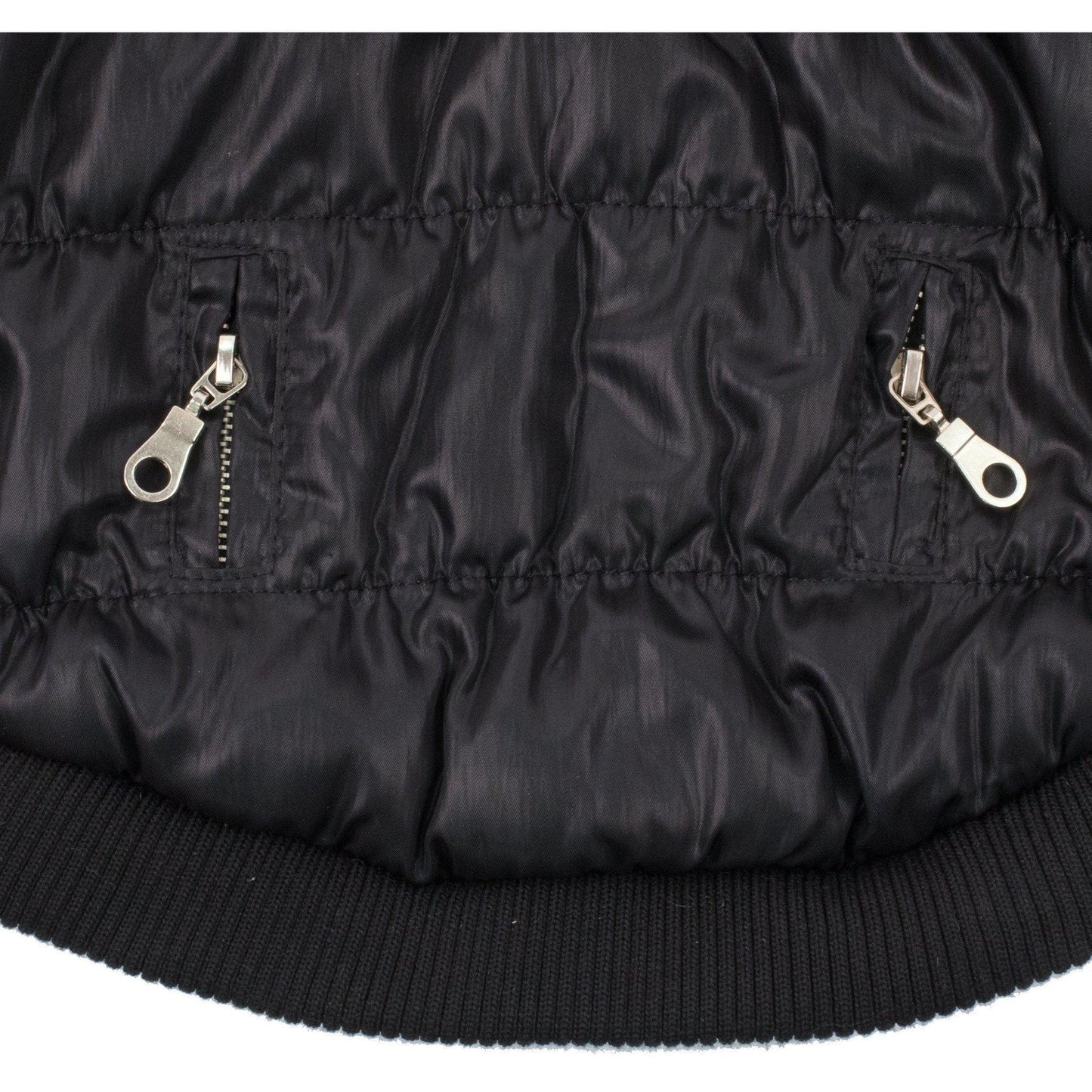 Close-up of a black puffer jacket with zippers on a white background