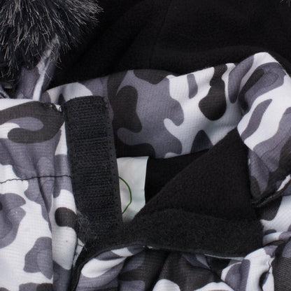 Close-up of a camouflage-patterned fabric with black straps