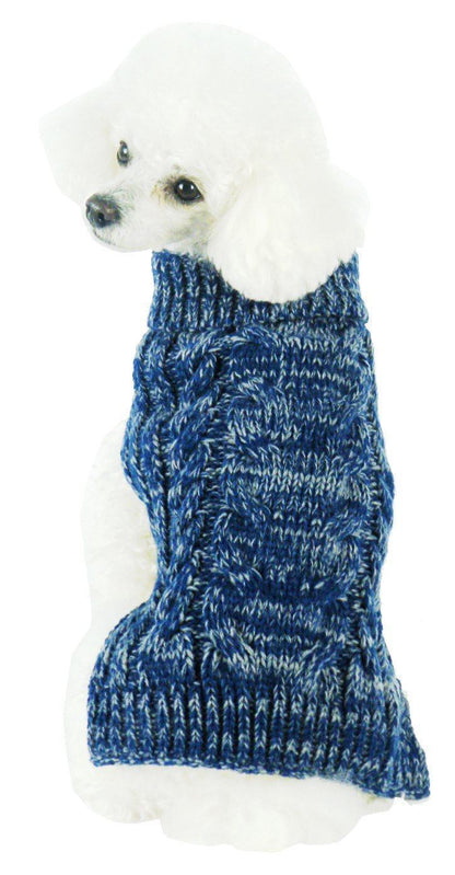 White dog wearing a blue knitted sweater on a white background