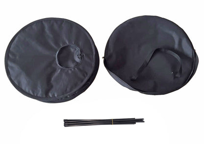 Two black round covers with a central hole and three black sticks on a white background