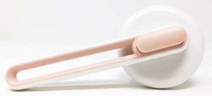 White and pink hair tie on a white background