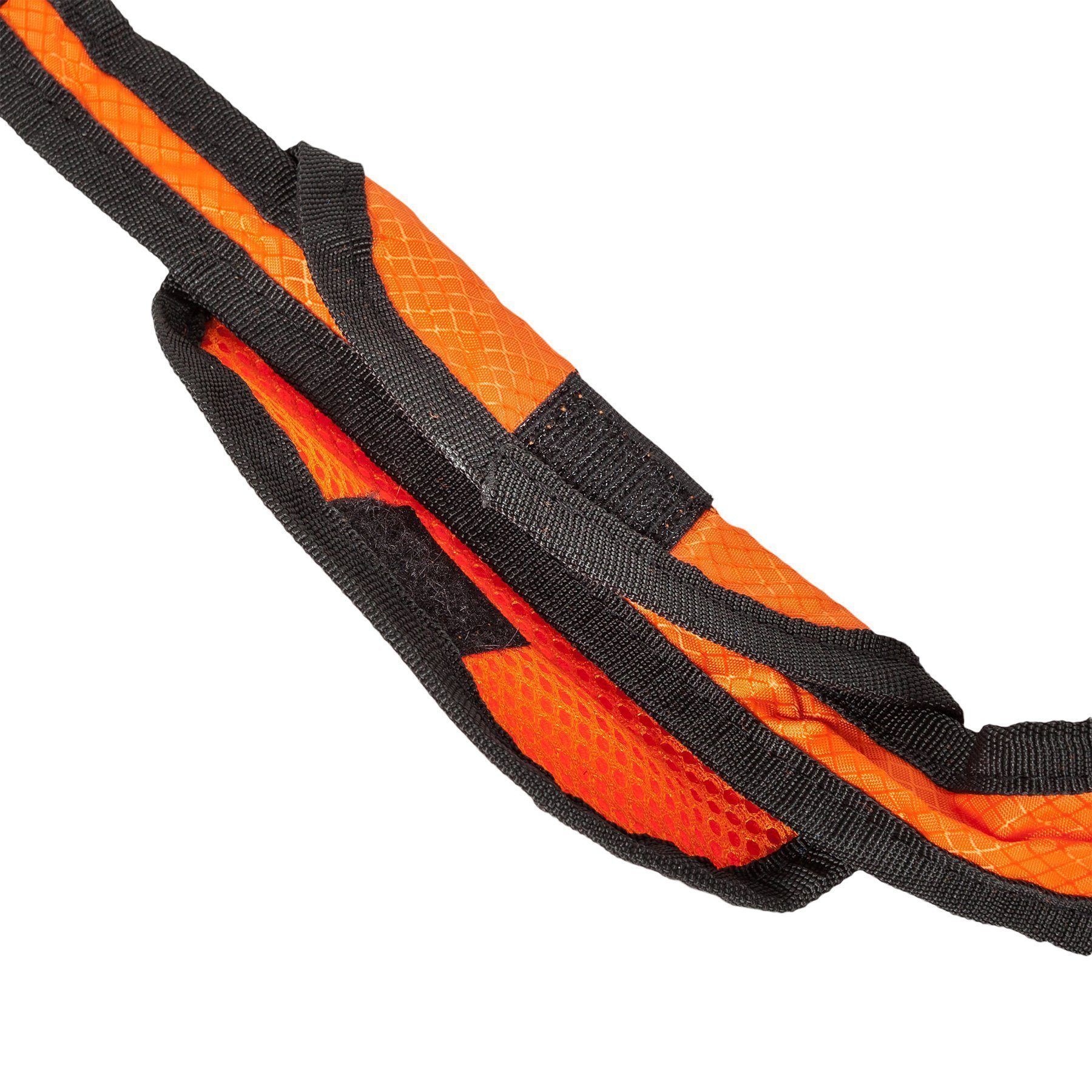 Close-up of an orange and black dog leash on a white background