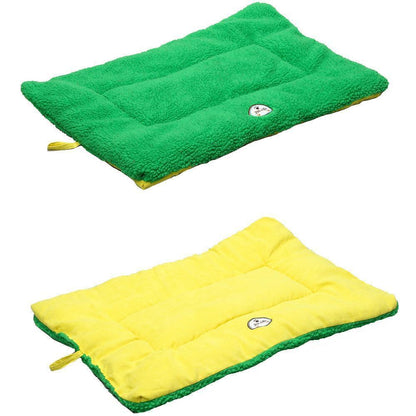 Two green and yellow quilted pet beds on a white background