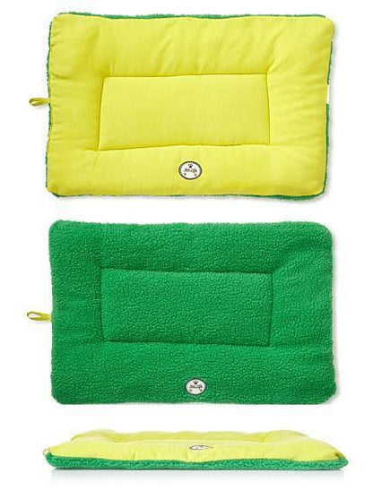 Three rectangular cushions in yellow, green, and a combination of both on a white background.