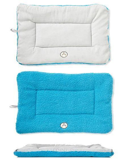 Three different colored pet beds on a white background