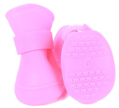 Pink silicone scrubber with textured surface on a white background