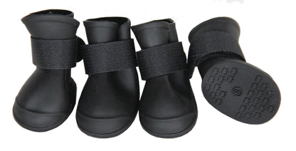 Four black pet boots with straps on a white background