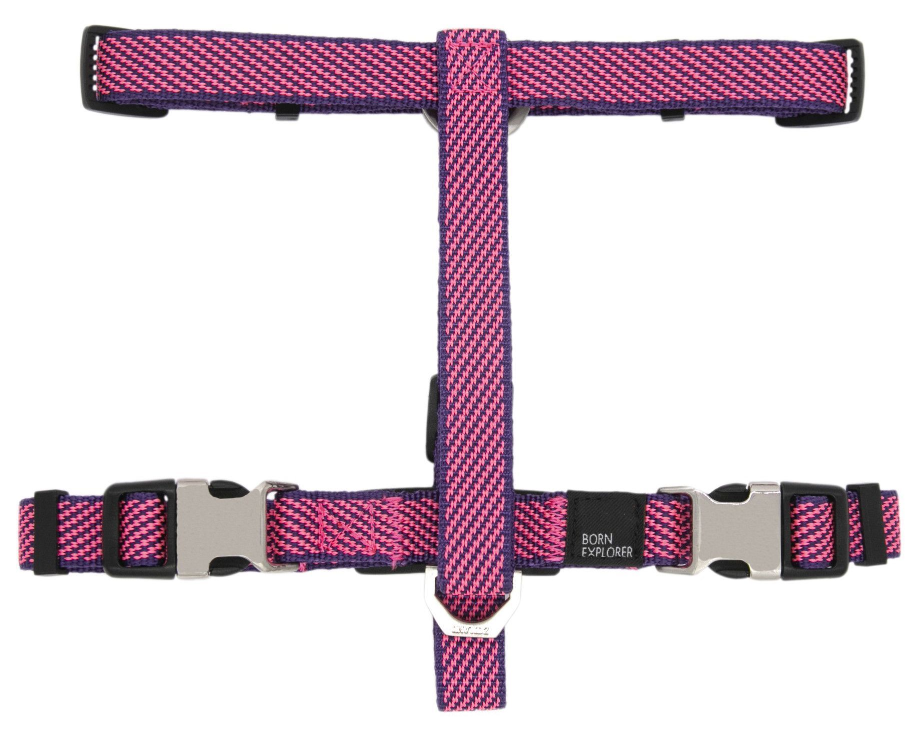 Pink and black patterned dog harness on a white background