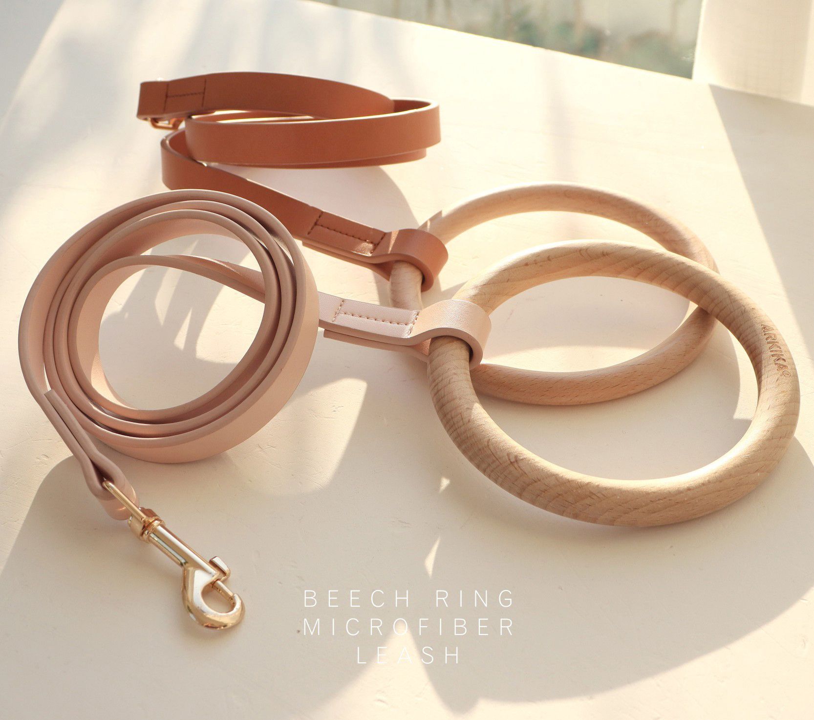 Dog leash and collar set on a light surface with 'Beech Ring Microfiber' text.