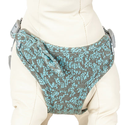 Gray and blue patterned baby carrier on a mannequin with a white background