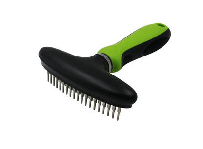 Pet grooming brush with black bristles and green handle on a white background