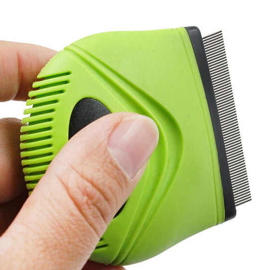 Green pet grooming brush held by a hand on a white background