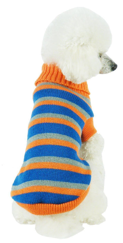 Dog wearing a striped sweater with orange, blue, and gray colors on a white background