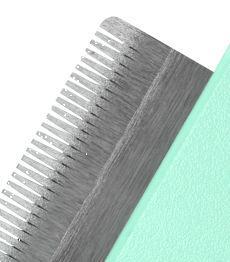 Metallic comb on a light green background