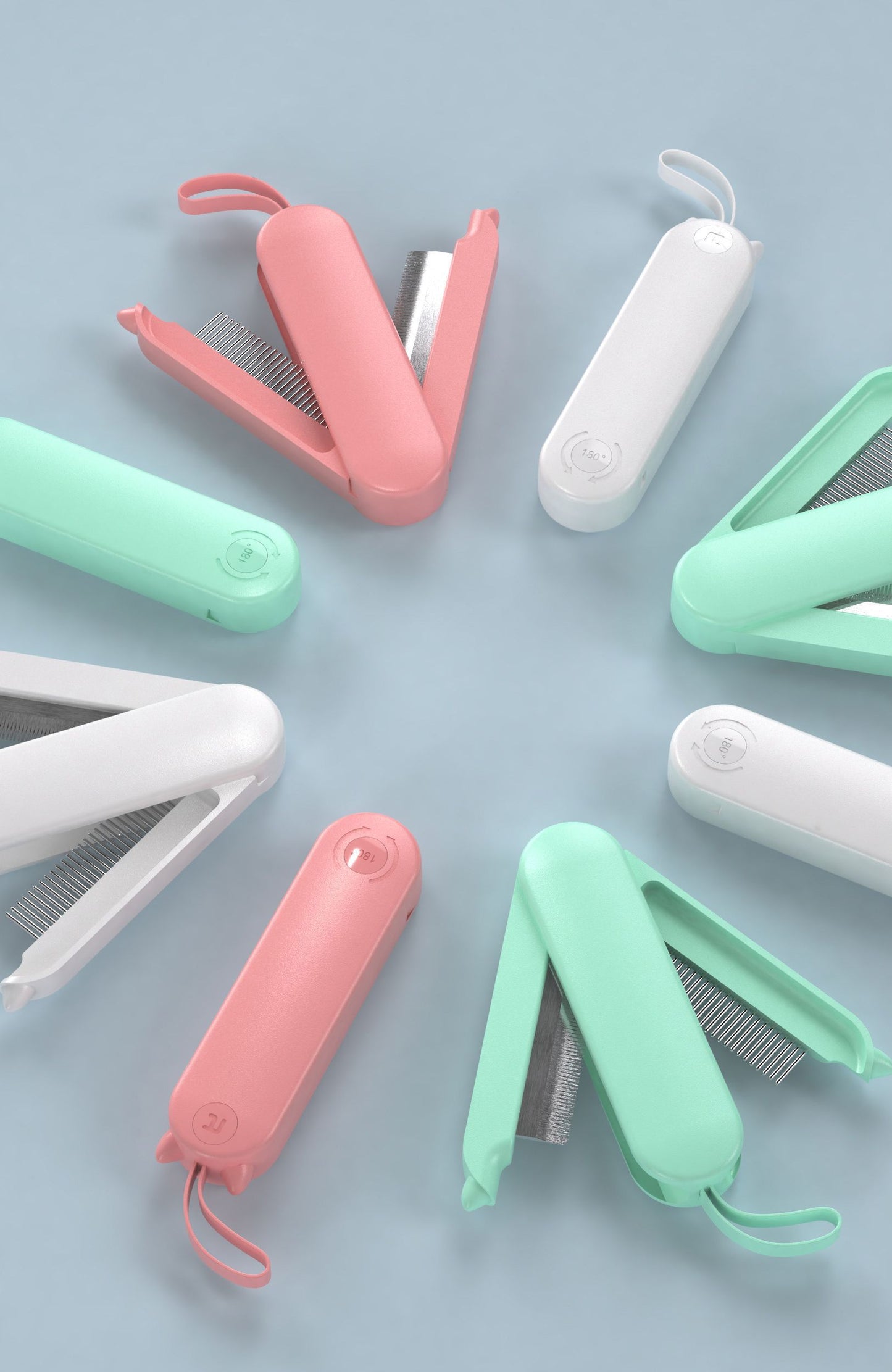 Set of grooming tools including combs and clips on a light blue background