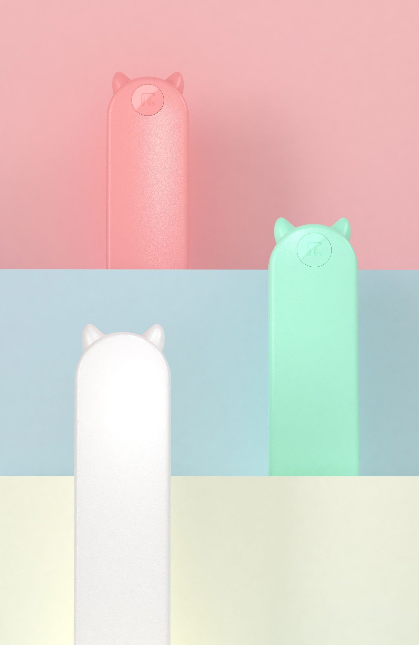 Three colorful cylindrical lamps with animal-shaped ends on a pastel striped background