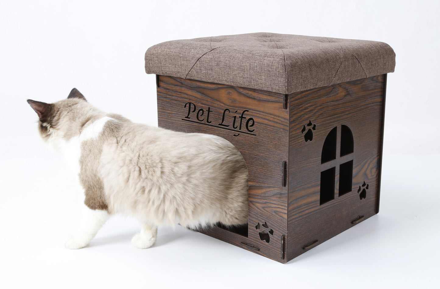 Cat standing next to a wooden pet house with 'Pet Life' branding on a white background