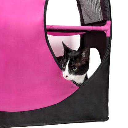 Black and white cat peeking out from a pink and black pet playpen.
